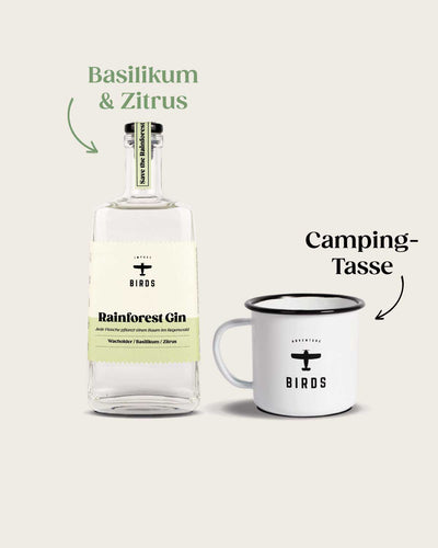 Rainforest Gin der Gin mit Impact von BIRDS hat die Botanicals Basilikum und Zitrus, daneben die BIRDS Festival Tasse.